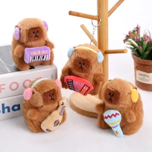 Cute musical capybara plush toy pendant detail showing cute instruments and headphones.