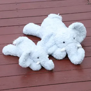 Soft blue elephant plush toy detailed view, cute stuffed animal pillow for kids sleeping.