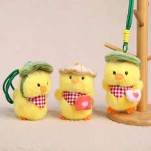 Cute yellow duck plush pendant with leaf hat and checkered scarf cute bag charm keychain toy