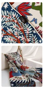 Detailed view of the mulberry silk scarf showcasing intricate print and tag label.