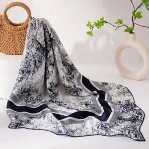Silk square scarf detail showing exquisite blue and white landscape print and texture.