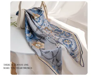 Silk square scarf with floral paisley print, elegant multi-functional neck accessory.