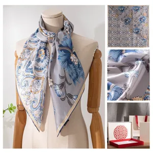Elegant mulberry silk scarf with blue floral paisley print, versatile summer neckerchief.