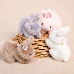 Fluffy plush bunny keychain detail, cute stuffed rabbit toy pendant in multiple colors.