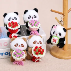 Cute panda plush keychain pendant holding flowers or mahjong tile, soft bag charm toy accessory.
