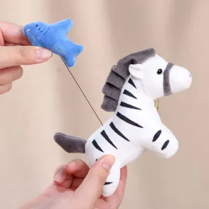 Cute zebra plush toy detail pendant with pull-string small fish design for bag charm.