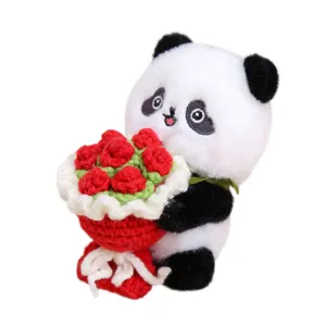Cute panda plush toy holding a crochet flower bouquet, perfect bag charm and keychain.