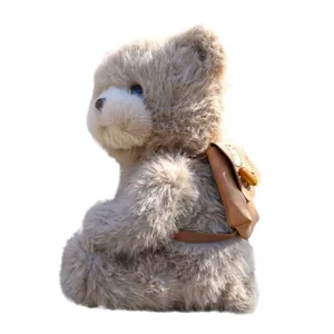 Süßer Plüsch Teddybär mit kleinem abnehmbaren Rucksack, weiches Kuscheltier für Kinder.