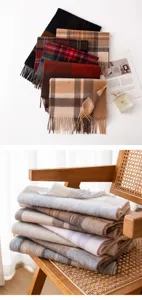 Detailed view of luxury cashmere-feel plaid scarves with soft fringe and warm autumn textures.