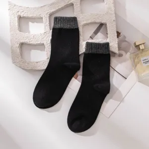 Cozy wool blend mid-tube socks in classic black and grey color, warm autumn and winter wear.