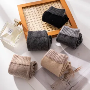 Thick wool blend mid-tube socks detail shot, cozy winter knitwear texture and warm colors.