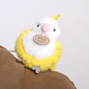Close-up detail of cute yellow and white plush parrot shoulder sitting toy with hanging tag.