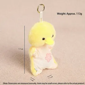Yellow plush doll keychain detail, cute stuffed animal charm with metal ring and flower.
