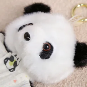 Close-up detail view of the cute panda plush toy keychain, showing soft fur texture and cute face.