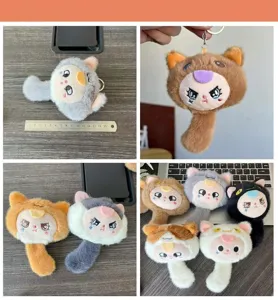 Cute fluffy plush toy keychain, adorable cartoon animal charm for bags and keys. Detail shot.