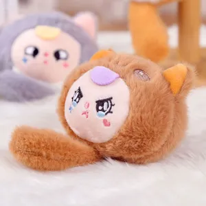 Close-up detail of cute plush pendant toy with embroidered crying face and soft furry texture.