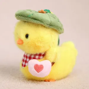 Detailed close-up view of the cute yellow duck plush pendant featuring a green leaf hat.