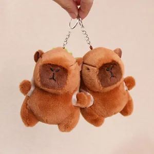 Cute capybara plush keychain with vegetable backpack, soft cartoon animal doll pendant for bag.