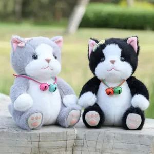 Cute plush cat dolls detail shot showing soft fur texture and adorable bell collars for decor.