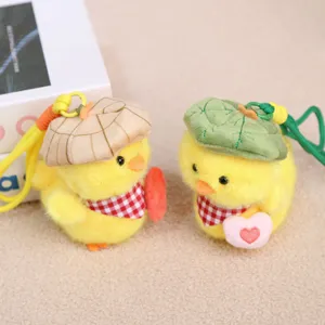 Cute yellow duck plush pendant detail showing the lovely leaf hat and checkered scarf design.