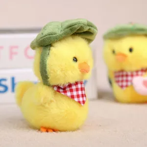 Cute yellow plush duck pendant with green leaf hat and red checkered bib, soft toy keychain.