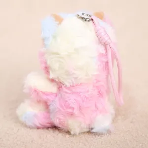 Close-up detail of the colorful tie-dye plush sheep keychain with soft fur and pink lanyard.