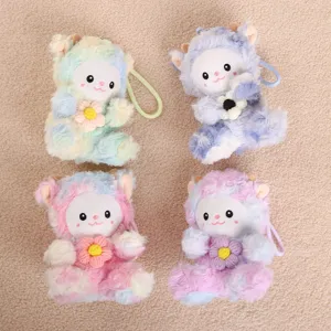 Close-up detail of cute tie-dye plush sheep keychain, colorful soft toy pendant with knitted flower.