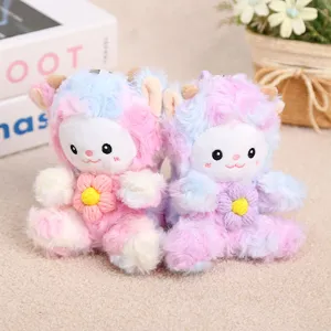 Detailed closeup of adorable tie-dye plush sheep keychains featuring soft fur and flowers.