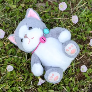 Cute grey cat plush toy with pink paws and bells, detailed close-up shot for home decor gift.
