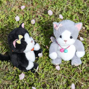 Cute plush cat toys set featuring soft fur, adorable bows and bells, perfect detail view.