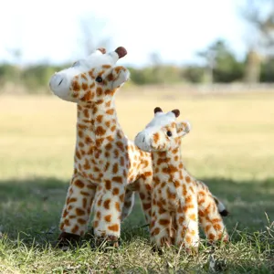 Detailed shot of cute standing giraffe plush toys set, soft stuffed animal companion and decor.