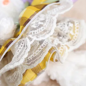 Plush rabbit pendant lace detail, cute fluffy toy accessory with yellow plaid fabric trim.