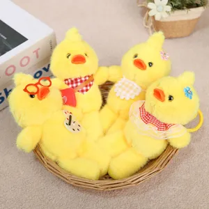 Cute yellow duck plush toy keychain detail, soft long leg doll bag hanging ornament.