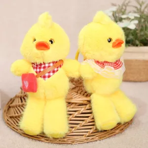 Cute long-legged yellow duck plush pendant, soft stuffed animal keychain for bag decoration.