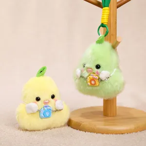 Cute plush duck pear pendant detail view, showing soft texture and mini camera accessory.