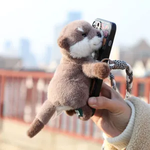 Cute otter plush toy phone holder, soft animal doll accessory for smartphones and daily gifts.
