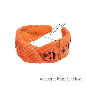 Halloween sequin knotted headband with beaded pumpkin design, wide hair hoop for party dress up.