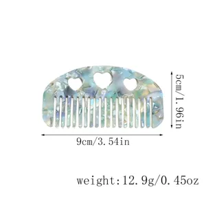 Acetate hair comb with lovely heart cutouts and gorgeous tortoise shell pattern detail.