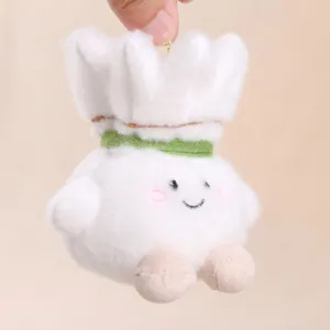 Close-up of cute badminton plush toy pendant, soft white fluffy texture with sweet smiling face.