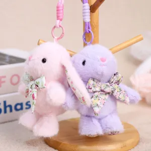 Grazioso portachiavi con coniglietto di peluche e fiocco floreale, bambola morbida da 11cm.