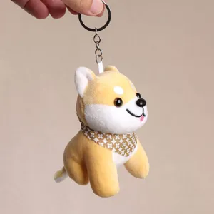 Shiba inu plush keychain detail showing cute dog toy with patterned scarf and metal ring.