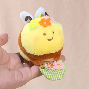 Cute plush bee keychain with flower basket, soft stuffed animal doll for kids and girls.