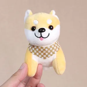 Close-up detail of a cute Shiba Inu plush toy keychain wearing a patterned scarf, soft.