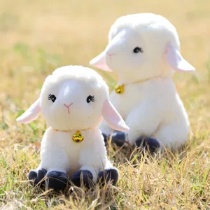 Cute bell sitting sheep plush toy detail showing soft white fur and gold bell for kids.