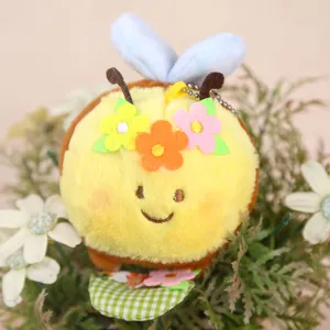 Cute little bee plush toy pendant detail view with lovely felt flowers and hanging chain.