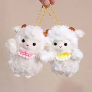 Plush sheep keychain detail shot showing fluffy texture and cute checkered bib design.