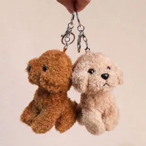 Cute fluffy poodle plush keychain, detailed close-up shot of soft stuffed puppy backpack charm.