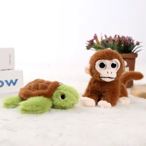 Close-up of cute plush turtle and monkey doll pendants with fluffy design and soft texture.