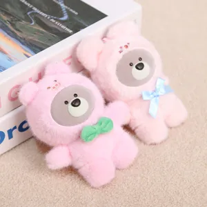 Adorably cute pink plush bear keychain with vinyl face and bow, soft toy bag pendant.