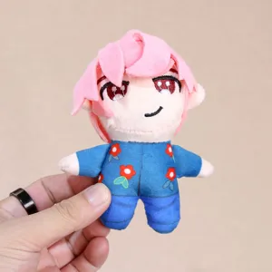 Cute anime plush doll pendant with pink hair and blue floral outfit, detailed close-up shot.